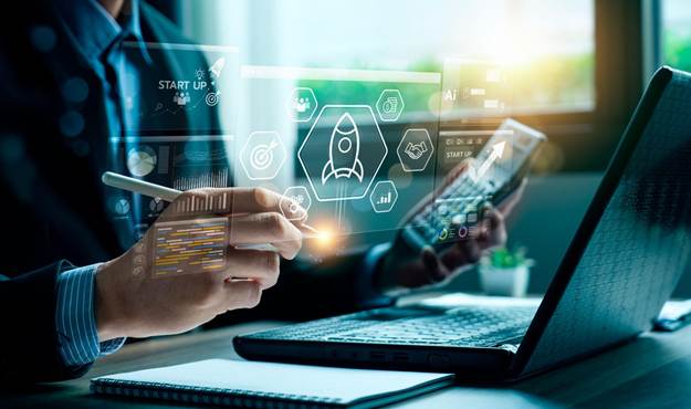 Entrepreneur engaging with advanced digital interface featuring startup analytics, strategic market insights, and innovation tools, highlighting business development, growth potential